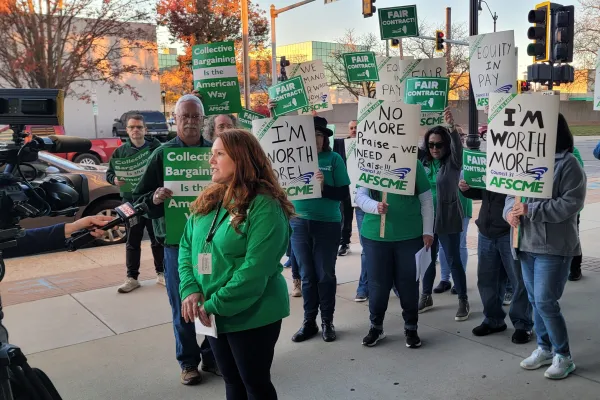 Local 2811 members speak to the media on the picket line.