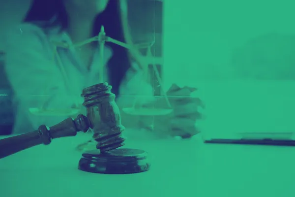 Stock image of a lawyer and the scales of justice