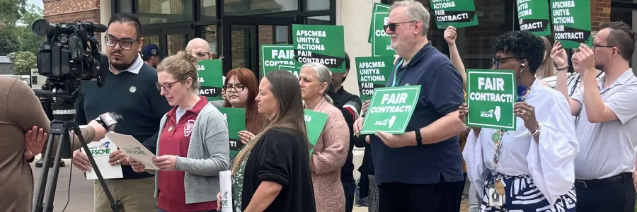 Members of Local 900 announce their strike authorization vote