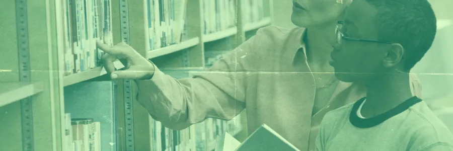 A stock image of a librarian in a row of books.