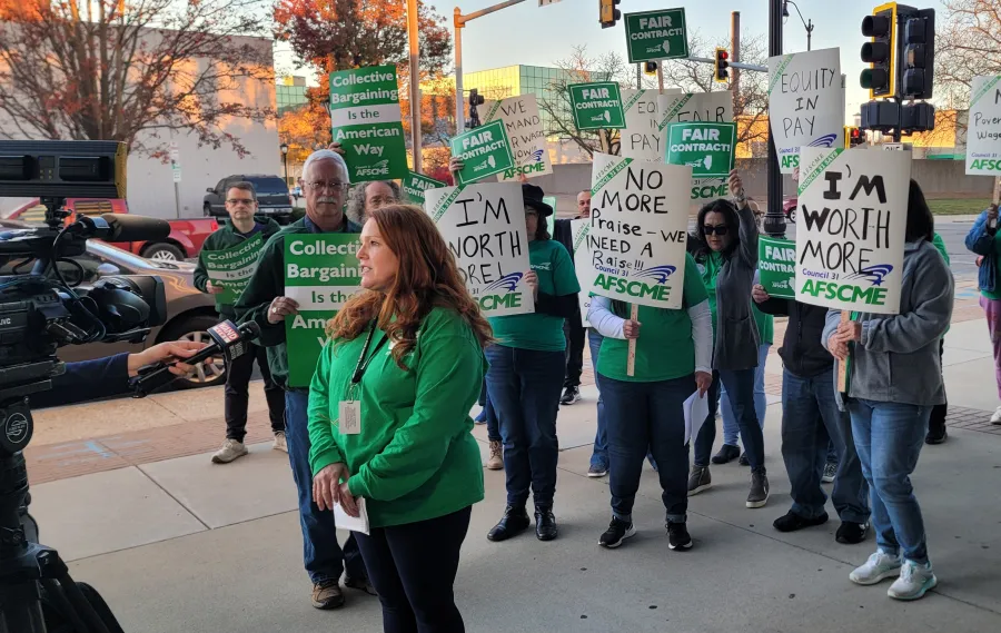 Local 2811 members speak to the media on the picket line.