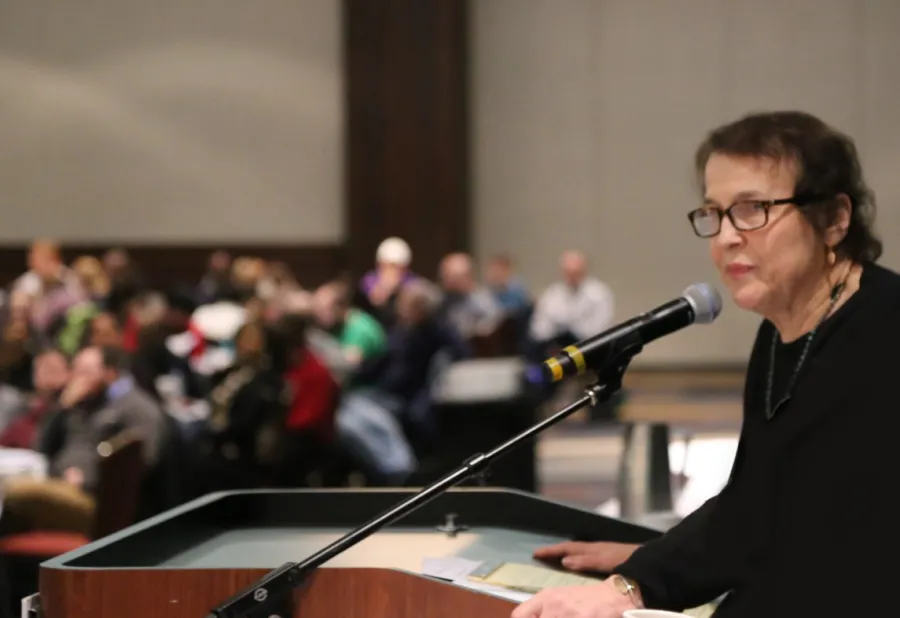 Roberta Lynch speaking at a podium