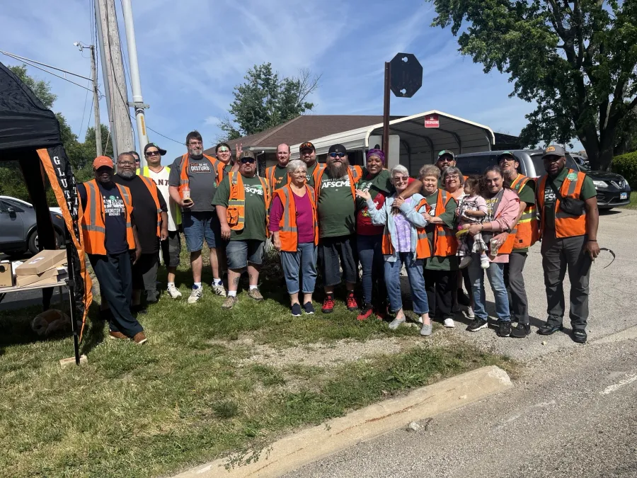 School bus drivers and monitors pose after having their union certified.