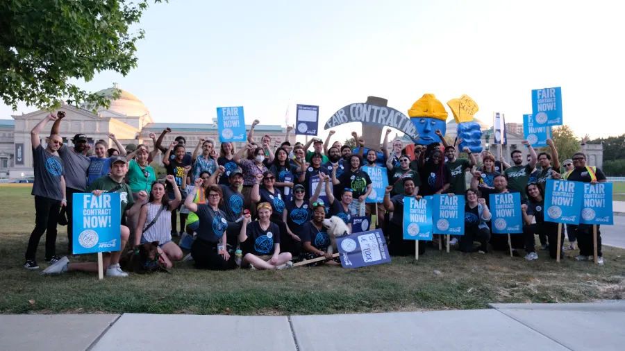 Museum of Science and Industry employees outside the museum. 