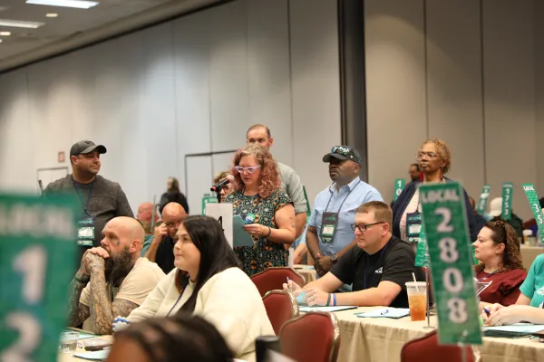 Delegates speak in support of a resolution