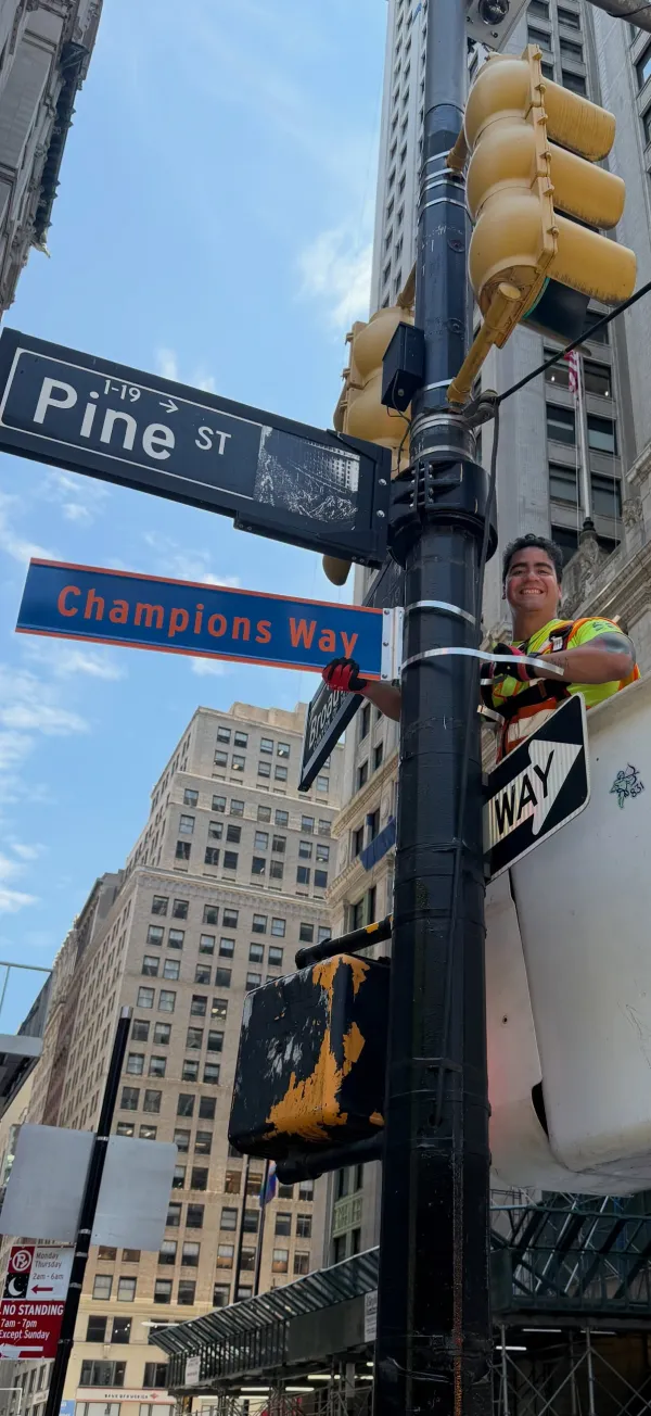 AFSCME members put the Champions Way street sign up